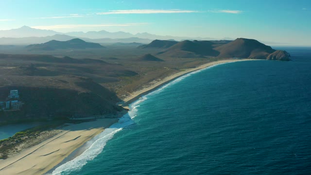 TODOS SANTOS BCS MEXICO-2021: Sandy Beach and Ocean Waves Along Rugged Coastline