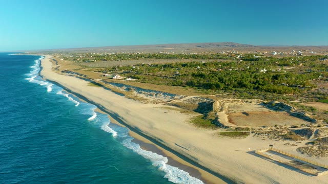 TODOS SANTOS BCS MEXICO-2021: Waves Rolling Onto a Sandy Coastal Beach