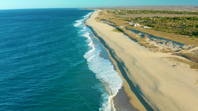 TODOS SANTOS BCS MEXICO-2021: Waves Rolling Onto Sandy Beach From Above