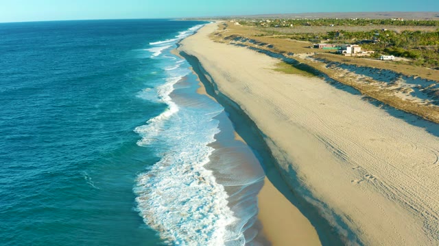TODOS SANTOS BCS MEXICO-2021: Ocean Waves Rolling Onto Sandy Shore