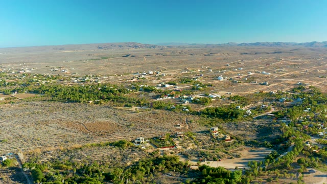 TODOS SANTOS BCS MEXICO-2021: Desert Community with Scattered Greenery and Structures
