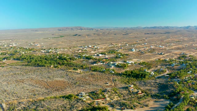 TODOS SANTOS BCS MEXICO-2021: Vehicle Traveling Through Arid Settlement