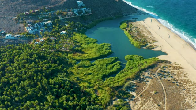 TODOS SANTOS BCS MEXICO-2021: Coastal Lagoon, Sandy Beach, and Hillside Buildings