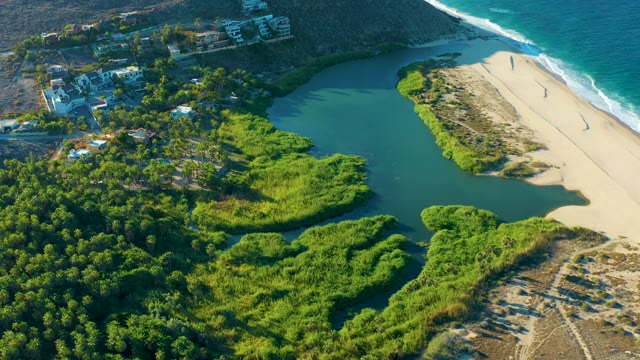 TODOS SANTOS BCS MEXICO-2021: Lagoon Water Flowing Along Coastal Beach