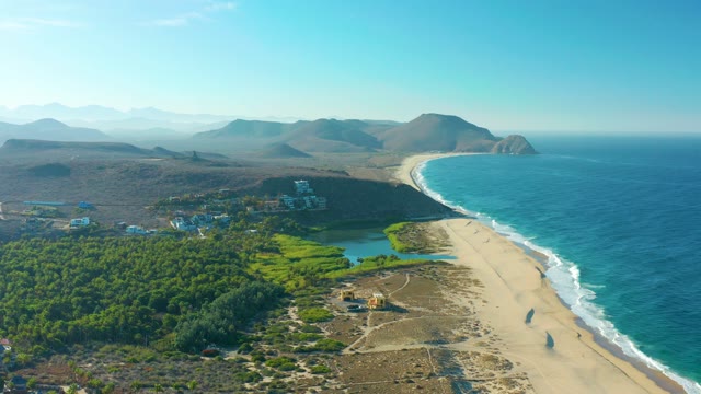 TODOS SANTOS BCS MEXICO-2021: Sandy Beach and Ocean Waves with Distant Mountains