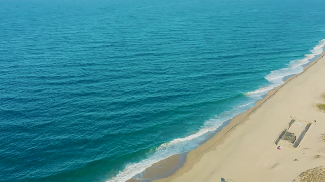 TODOS SANTOS BCS MEXICO-2021: Gentle Ocean Waves Lapping a Sandy Beach with a Person Walking