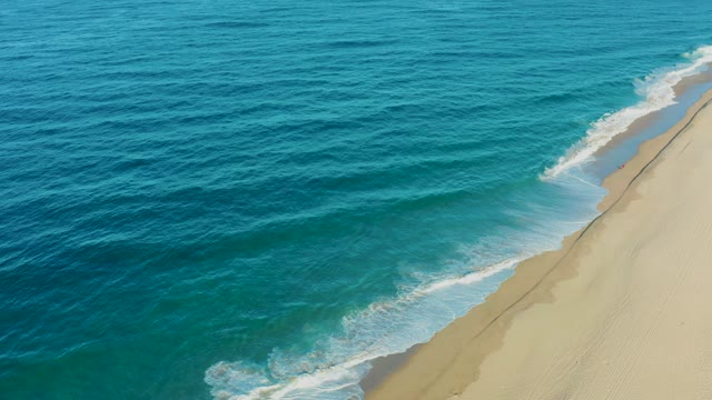 TODOS SANTOS BCS MEXICO-2021: Ocean Waves Rolling Onto Sandy Shore From Above