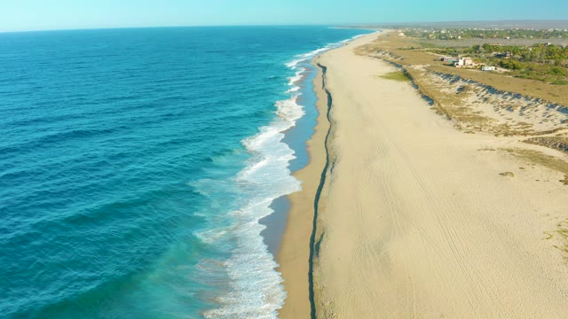 TODOS SANTOS BCS MEXICO-2021: Waves Rolling Onto Sandy Beach From Aerial View