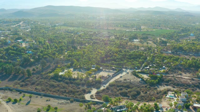 TODOS SANTOS BCS MEXICO-2021: Aerial of Road Winding Through Forested and Arid Land