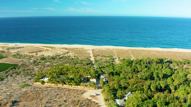 TODOS SANTOS BCS MEXICO-2021: Coastal Road with Passing Car and Ocean