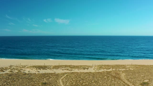 TODOS SANTOS BCS MEXICO-2021: Ocean Waves and Clouds Moving over Sandy Beach