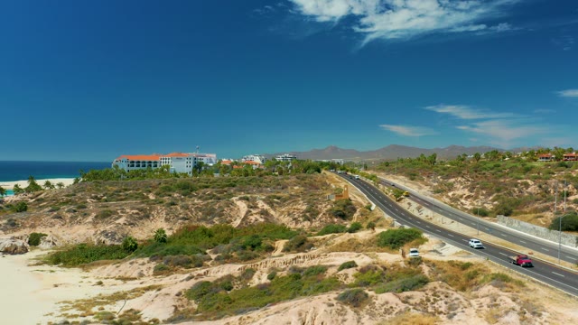 MARQUIS LOS CABOS MEXICO-2021: Coastal Highway with Moving Vehicles and Ocean View