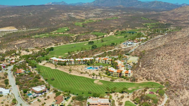 MARQUIS LOS CABOS MEXICO-2021: Golf Course and Moving Vehicles on Surrounding Roads