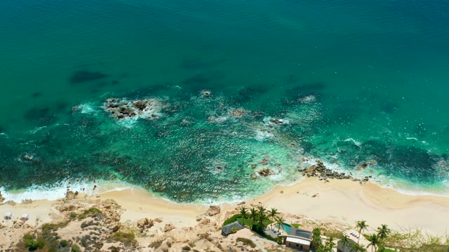 MARQUIS LOS CABOS MEXICO-2021: Waves Breaking on Rocky Coastal Shoreline