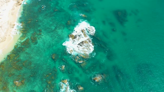 MARQUIS LOS CABOS MEXICO-2021: Waves Crashing on Rocky Shore From Above