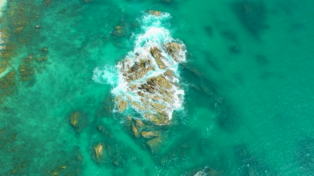 MARQUIS LOS CABOS MEXICO-2021: Waves Crashing on Rocky Ocean Outcrop