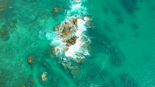 MARQUIS LOS CABOS MEXICO-2021: Waves Crashing on Coastal Rocky Outcrops
