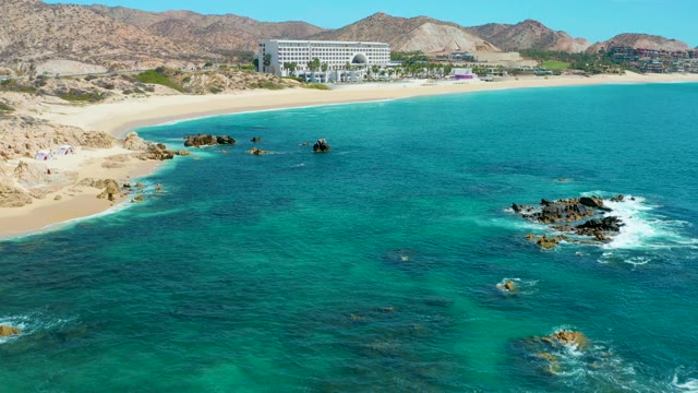 MARQUIS LOS CABOS MEXICO-2021: Coastal Beach with Turquoise Waters and Rocky Outcrops
