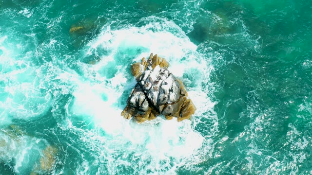 MARQUIS LOS CABOS MEXICO-2021: Ocean Waves Splashing Around Rocky Formation