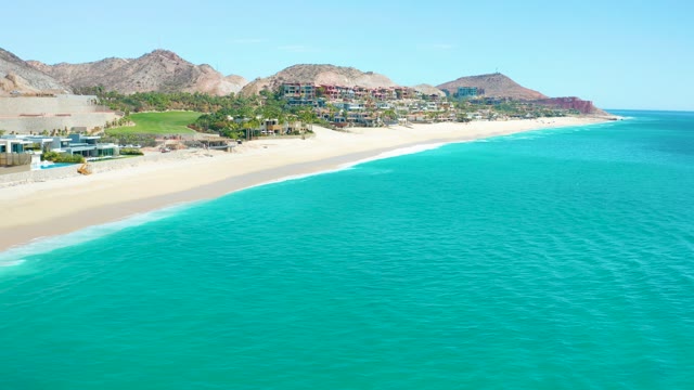 MARQUIS LOS CABOS MEXICO-2021: Waves Rolling Onto Sandy Beach