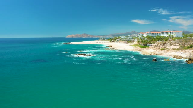 MARQUIS LOS CABOS MEXICO-2021: Waves Crashing on Rocky Coastal Shore