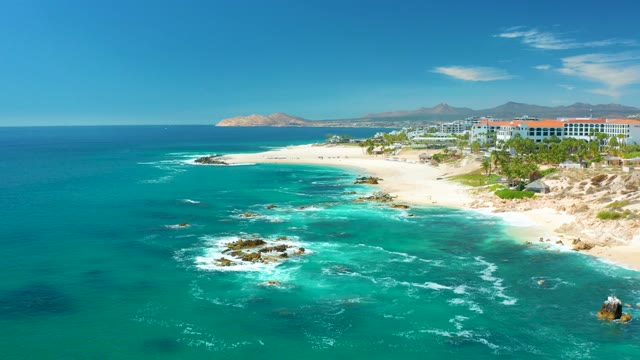MARQUIS LOS CABOS MEXICO-2021: Waves Crashing on Rocky Coastal Beach