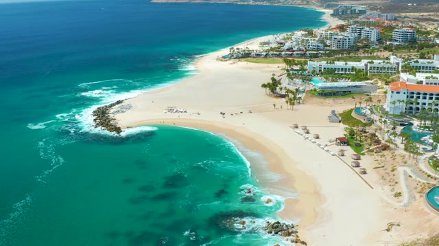 MARQUIS LOS CABOS MEXICO-2021: Waves Ebbing and Flowing on Sandy Shore