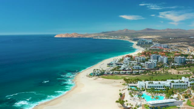 MARQUIS LOS CABOS MEXICO-2021: Waves Rolling Onto Sandy Coastal Shoreline