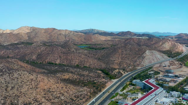 MARQUIS LOS CABOS MEXICO-2021: Highway Through Arid Mountain Landscape