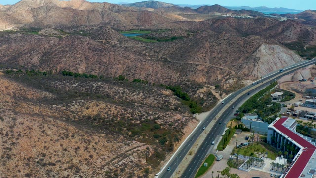 MARQUIS LOS CABOS MEXICO-2021: Highway Through Arid Mountain Landscape