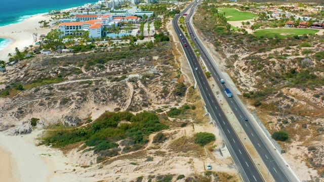MARQUIS LOS CABOS MEXICO-2021: Coastal Highway Traffic and Ocean Shoreline