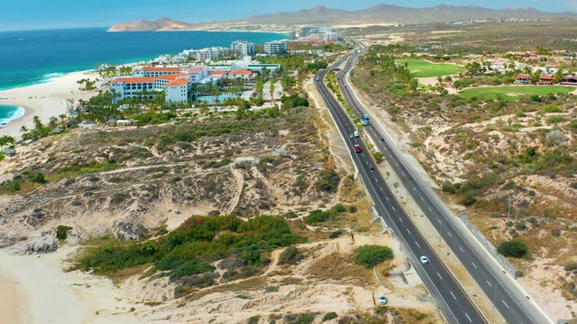 MARQUIS LOS CABOS MEXICO-2021: Coastal Highway with Moving Vehicles and Ocean View