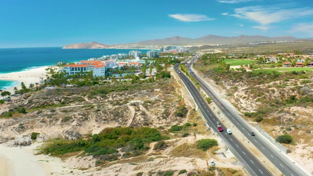 MARQUIS LOS CABOS MEXICO-2021: Coastal Road with Moving Vehicles and Ocean View