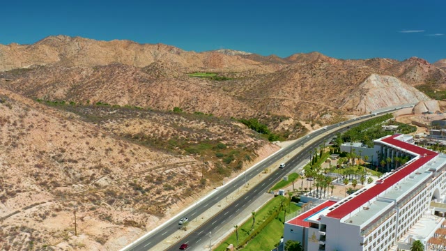 MARQUIS LOS CABOS MEXICO-2021: Highway Through Arid Mountain Landscape