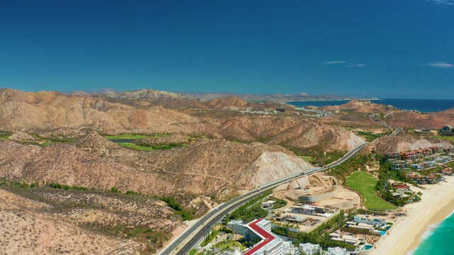 MARQUIS LOS CABOS MEXICO-2021: Vehicle Traveling Along Coastal Mountain Road