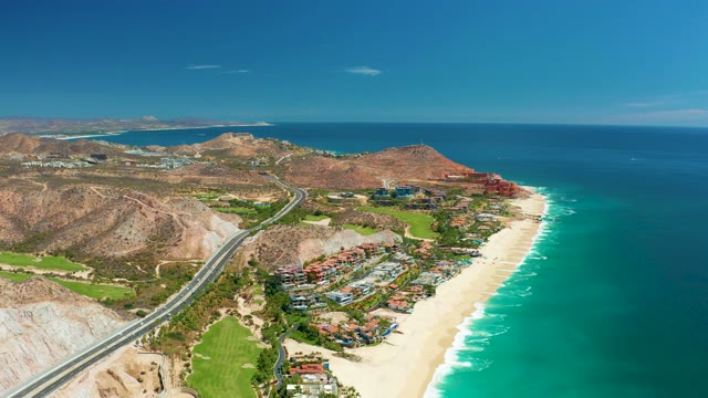 MARQUIS LOS CABOS MEXICO-2021: Vehicles Traveling Along Coastal Highway and Beach