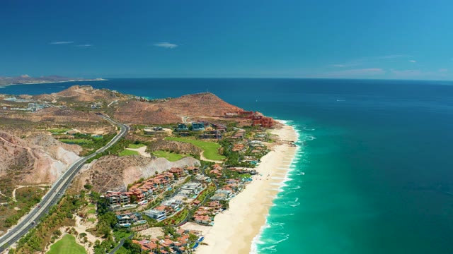 MARQUIS LOS CABOS MEXICO-2021: Coastal Highway with Moving Vehicle and Sandy Beach