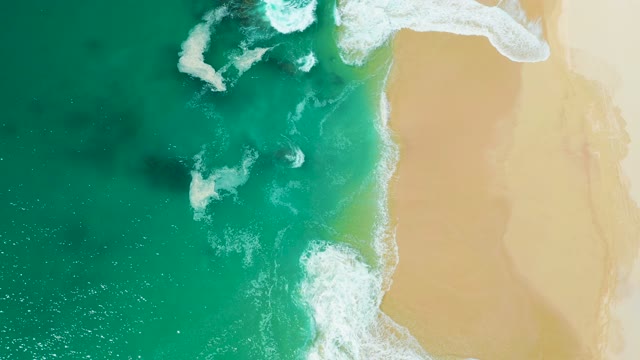 MARQUIS LOS CABOS MEXICO-2021: Waves Rolling Onto Sandy Beach From Above