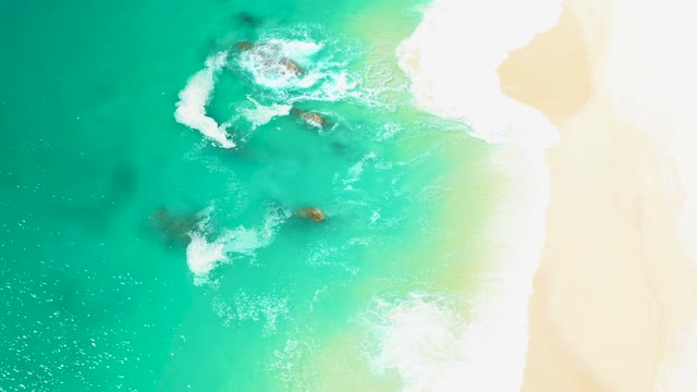 MARQUIS LOS CABOS MEXICO-2021: Waves Crashing Against Rocky Shore From Above
