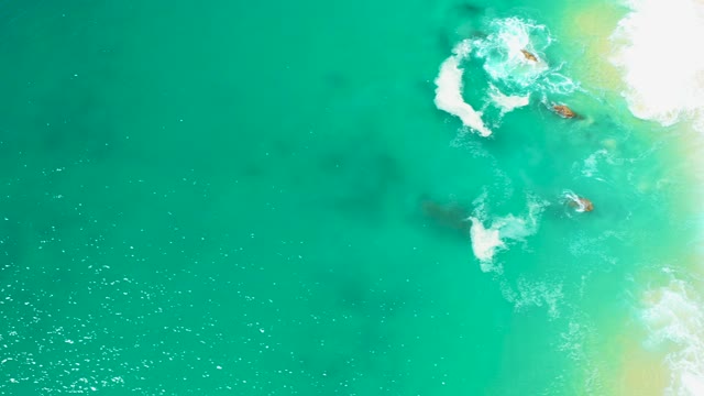 MARQUIS LOS CABOS MEXICO-2021: Turquoise Ocean Water Flowing over Rocky Shoreline