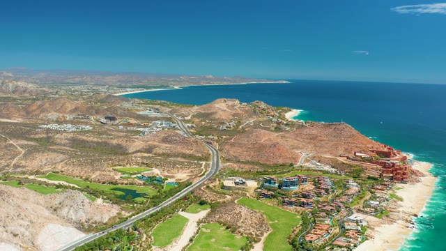 MARQUIS LOS CABOS MEXICO-2021: Coastal Highway with Car Passing by Beach