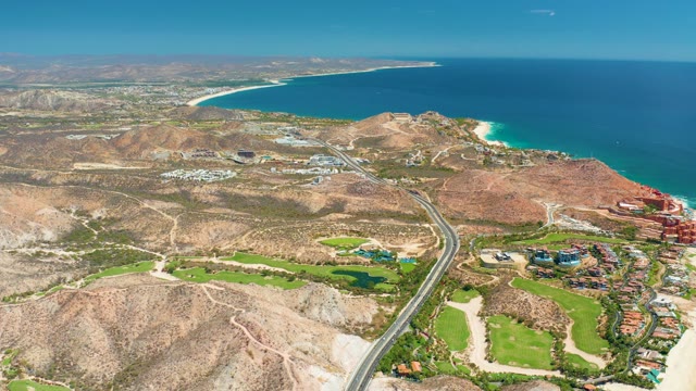 MARQUIS LOS CABOS MEXICO-2021: Aerial Pan of Coastal Road and Golf Course