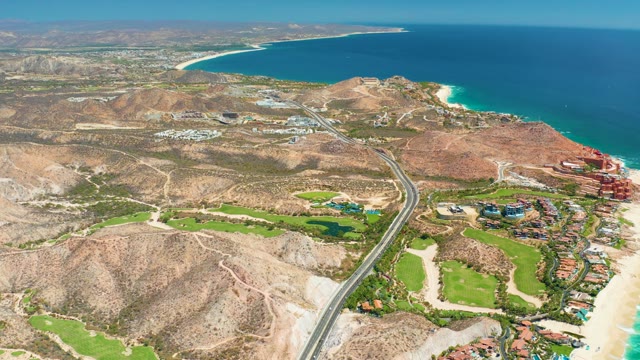 MARQUIS LOS CABOS MEXICO-2021: Coastal Highway with Moving Vehicle and Hills
