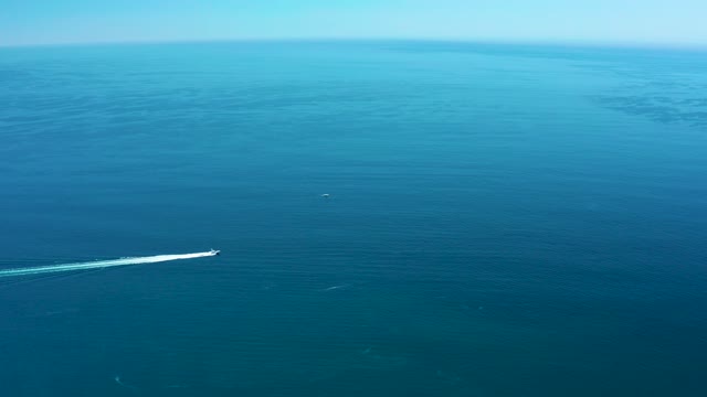 MARQUIS LOS CABOS MEXICO-2021: Speedboat Cutting Through Calm Ocean Waters
