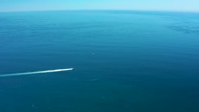 MARQUIS LOS CABOS MEXICO-2021: Speedboat Creating White Wake on Calm Ocean