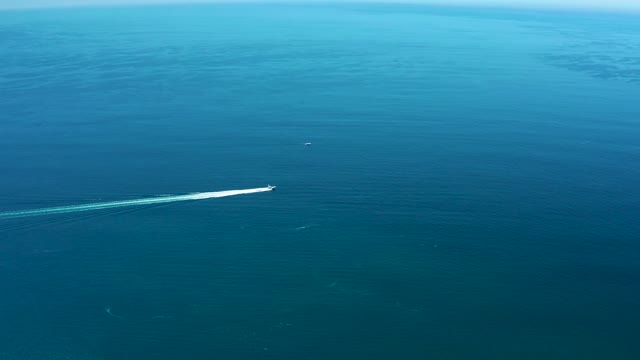 MARQUIS LOS CABOS MEXICO-2021: Speedboat Creating Wake on Calm Ocean