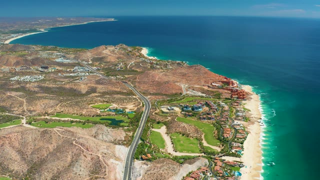 MARQUIS LOS CABOS MEXICO-2021: Coastal Highway Along Sandy Beach and Arid Hills