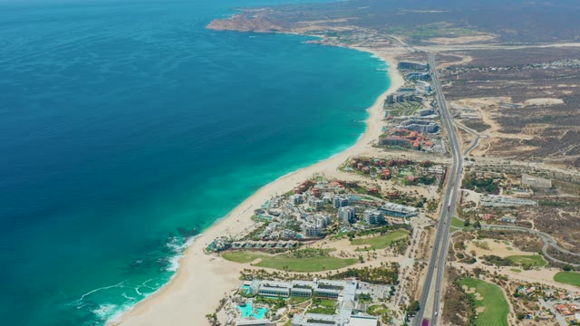MARQUIS LOS CABOS MEXICO-2021: Vehicle Traveling Along Coastal Highway Near Beach