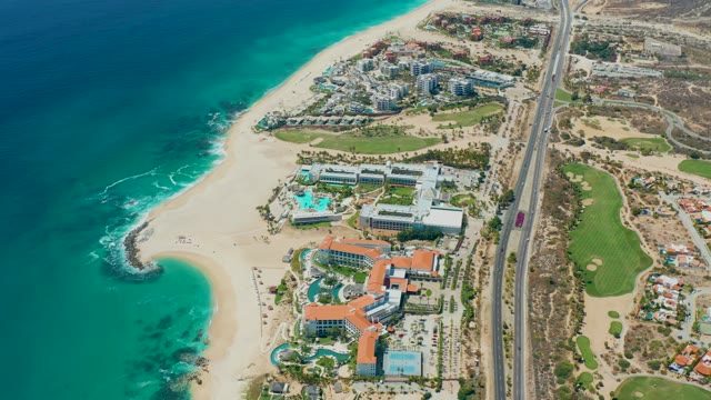 MARQUIS LOS CABOS MEXICO-2021: Coastal Resort and Highway Along Sandy Beach