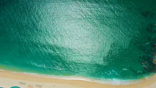 MARQUIS LOS CABOS MEXICO-2021: Gentle Waves Rolling Onto Sandy Beach From Above